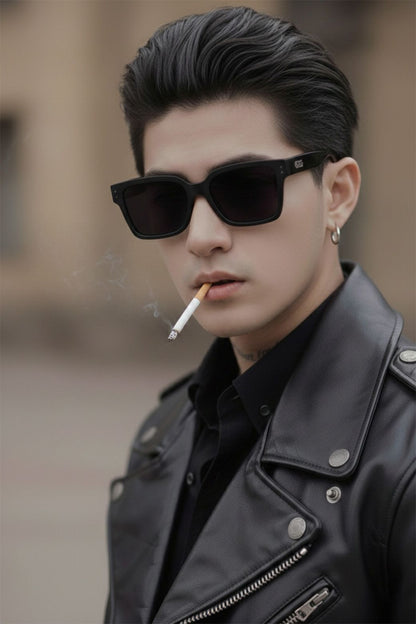 Person wearing Gentle Monster Gent 01 and a black leather jacket with a blurred background