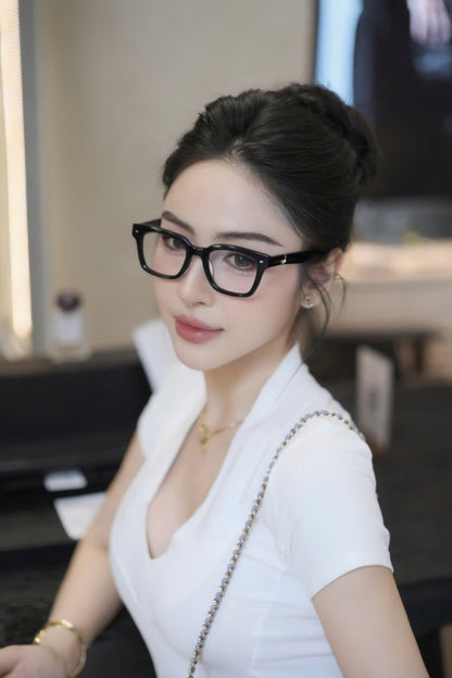 Woman wearing Gentle Monster - GM Alto 01 and a white top in an indoor setting