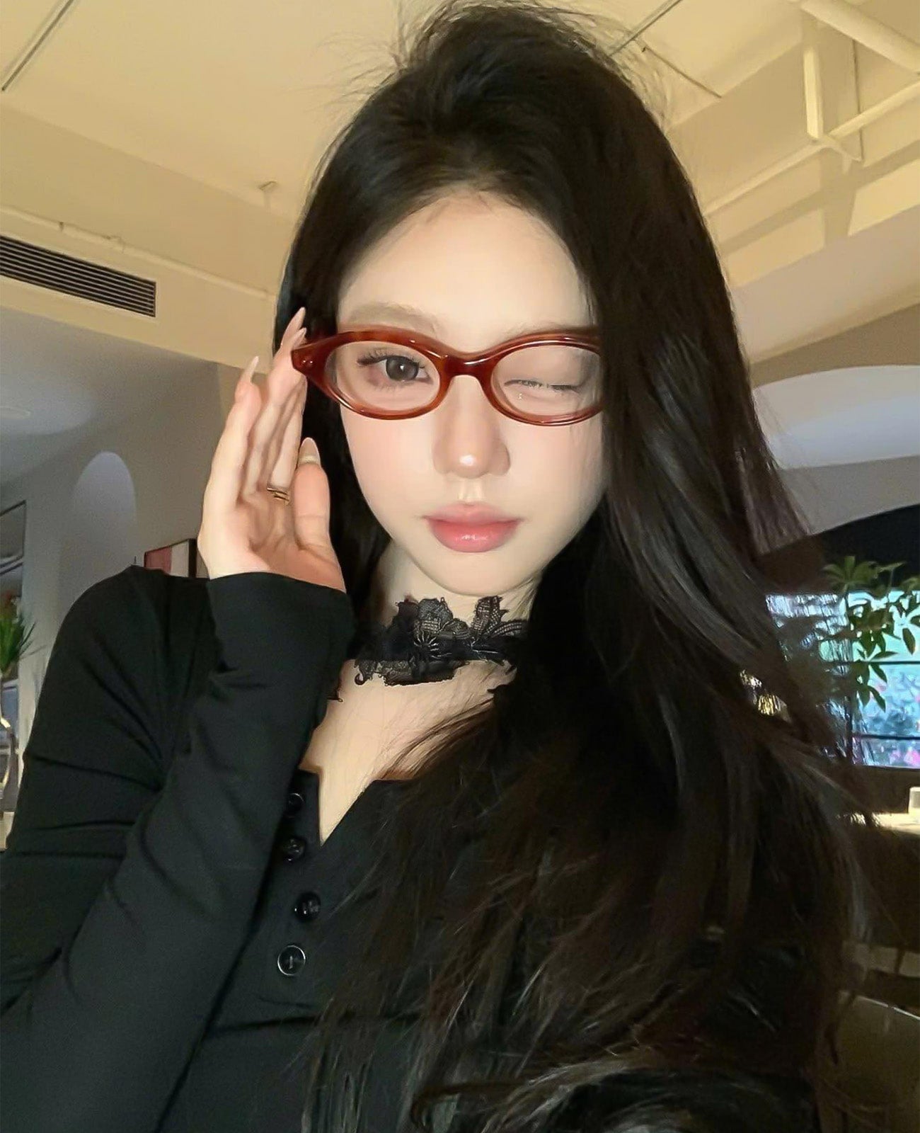 Person wearing Gentle Monster - GM Corori T4 and a black outfit indoors