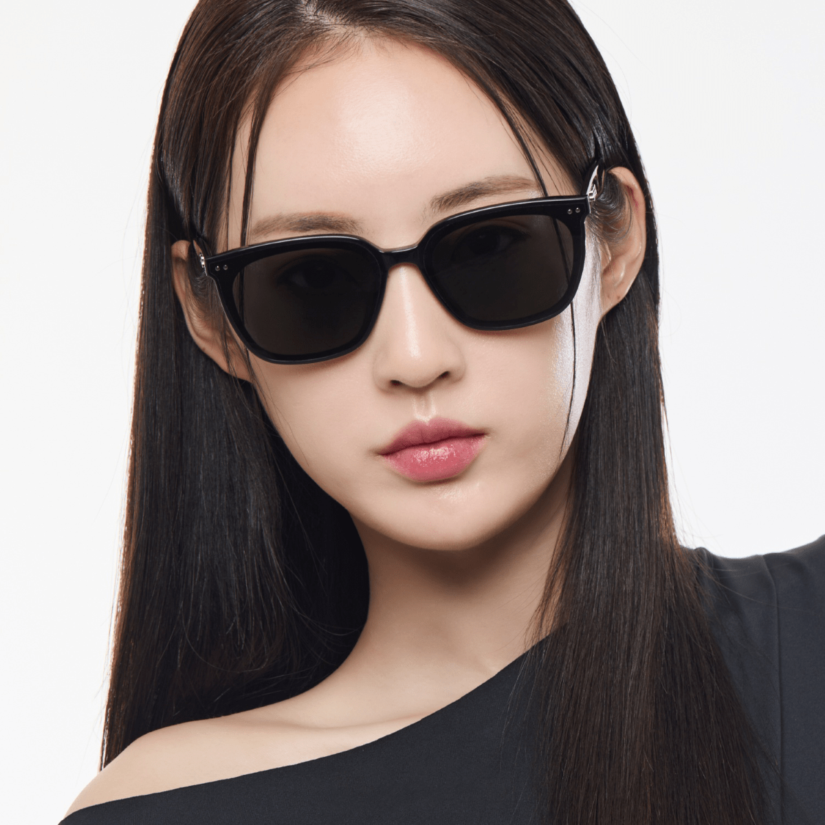 Woman wearing Gentle Monster (GM) Heizer 01 against a white background