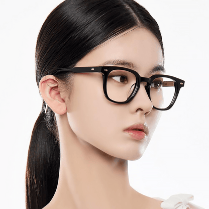 Woman wearing Gentle Monster (GM) Kubo 01 with a plain white background