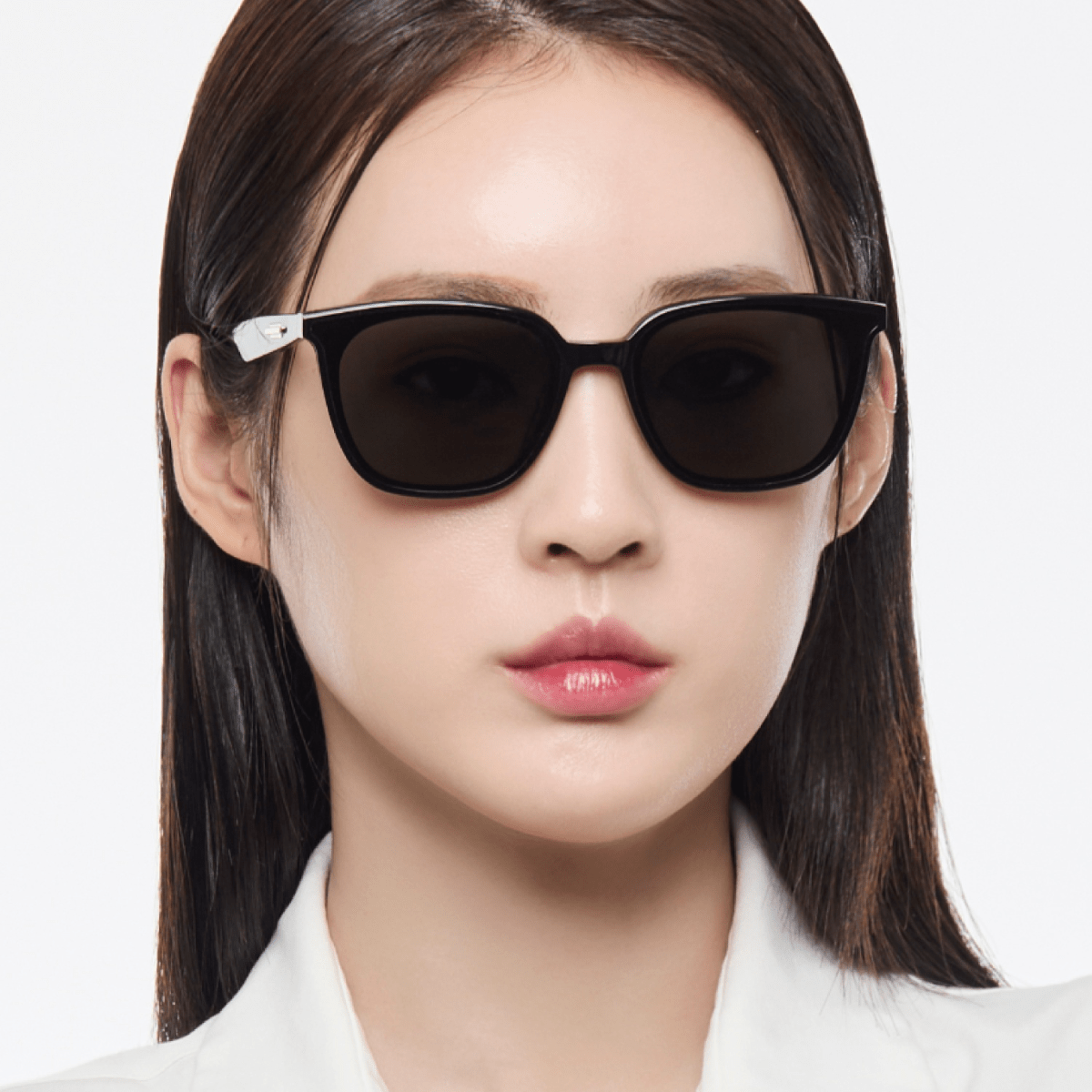 Woman wearing Gentle Monster (GM) Lilit 01 against a white background
