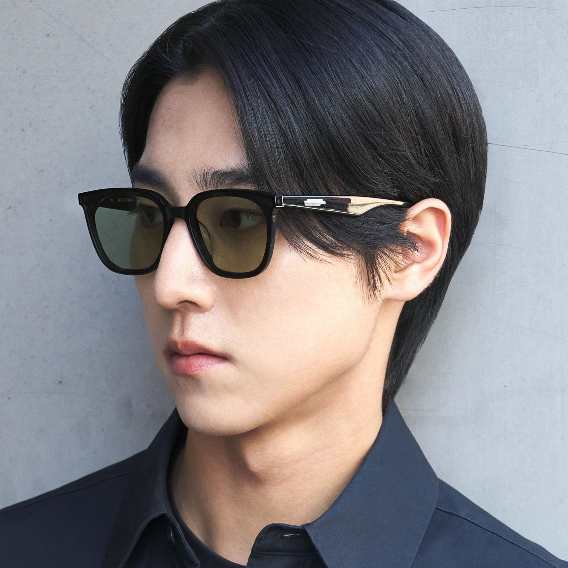 A Man wearing Gentle Monster - GM Lilit 01(K) with a neutral background