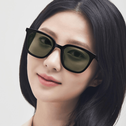 women wearing Gentle Monster - GM Lilit 01(K) with a plain background