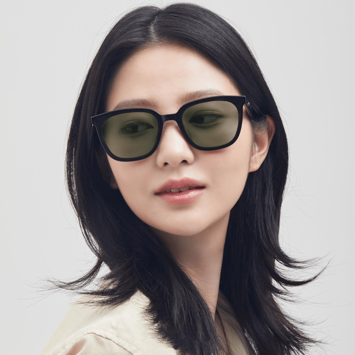Woman wearing Gentle Monster - GM Lilit 01(K) against a light background