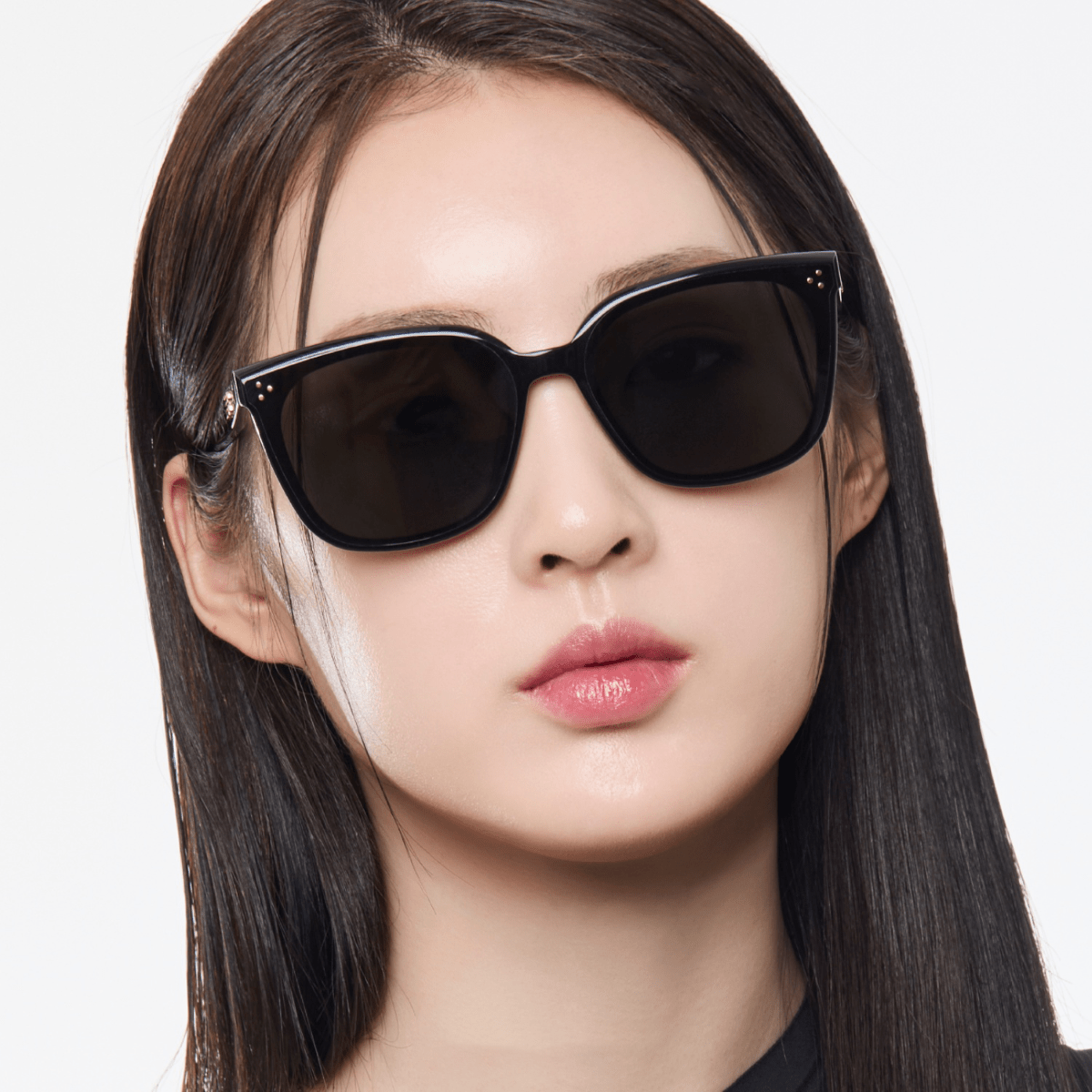 Woman wearing Gentle Monster (GM) Loloe 01 against a white background
