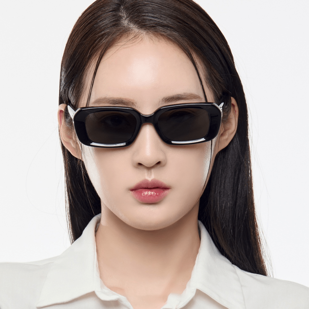 Woman wearing Gentle Monster (GM) Melrose 01 with a plain white background