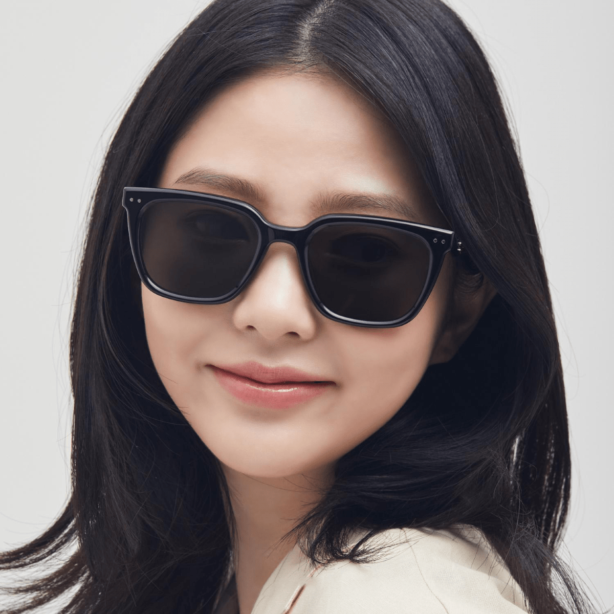 Woman wearing Gentle Monster (GM) Nubo 01 with a neutral background