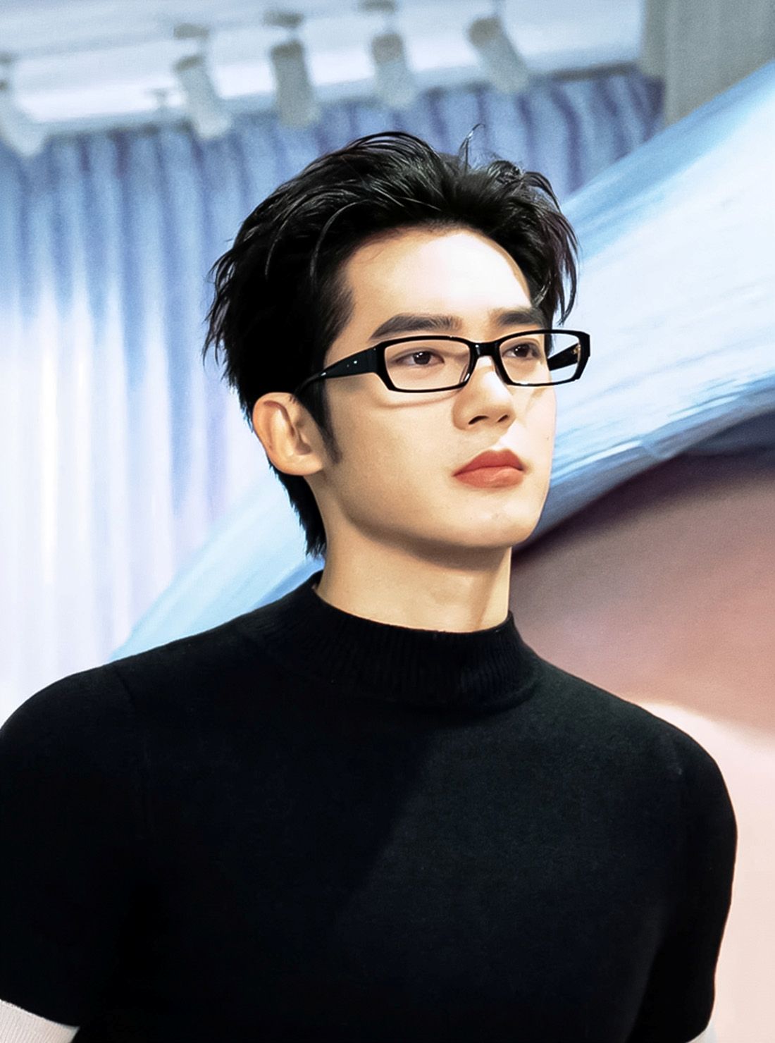 Person wearing Gentle Monster Halo G18 and a black turtleneck in an indoor setting