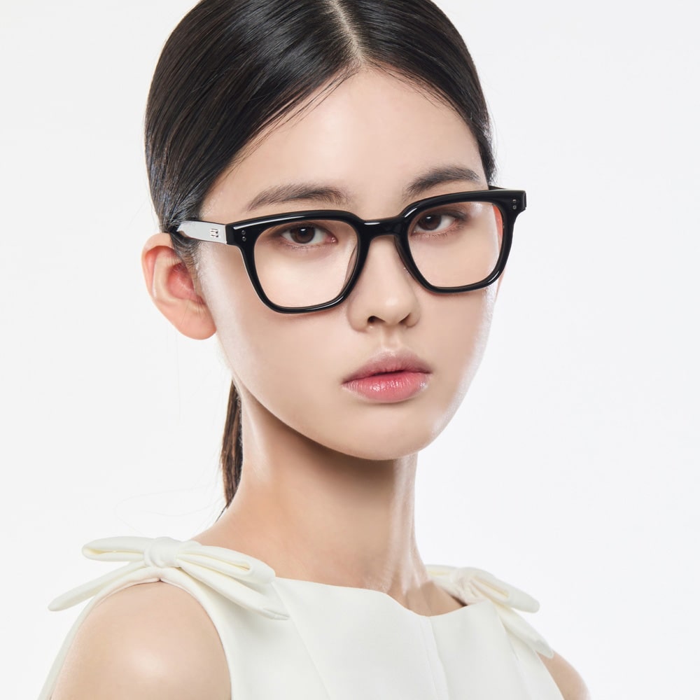 Woman wearing Gentle Monster Karl 01 Square Optical Glasses against a light background