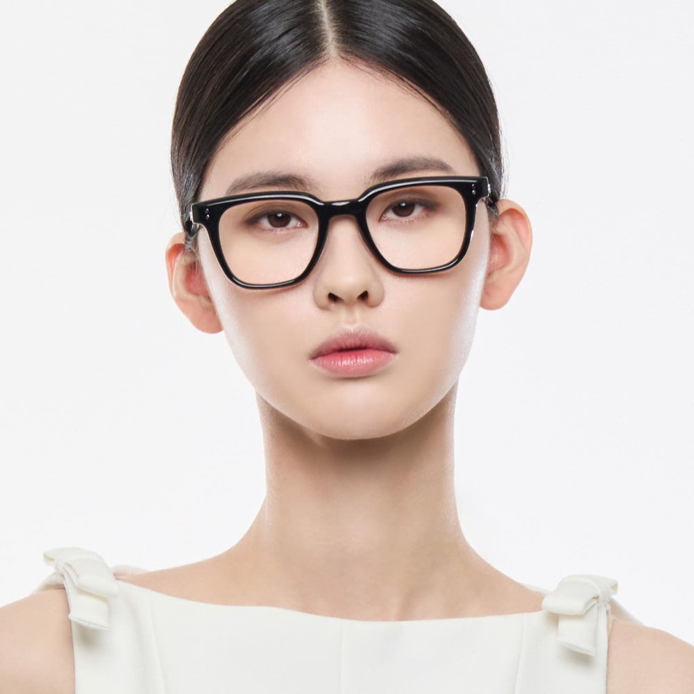 Woman wearing Gentle Monster Karl 01 Square Optical Glasses on a white background