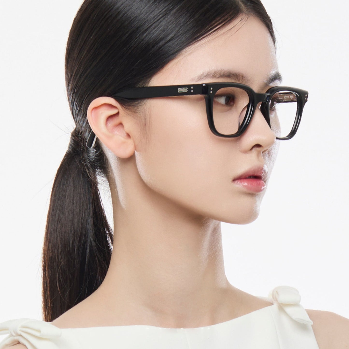 Woman wearing Gentle Monster Karl 01 Square Optical Glasses with a plain background