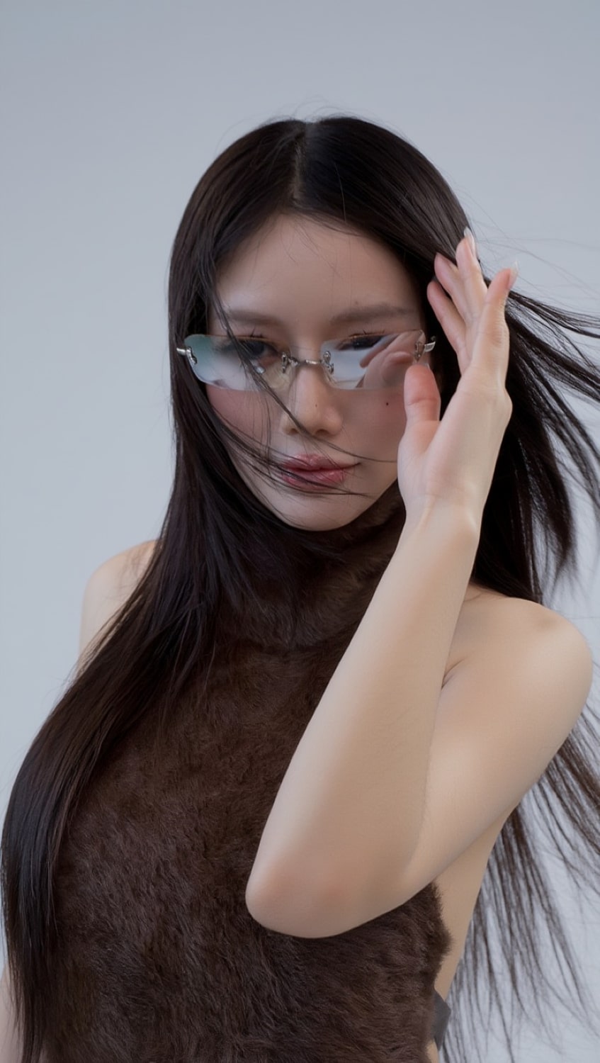 Woman with long dark hair wearing Gentle Monster Paranoyd 02(GM) Square Glasses against a plain background