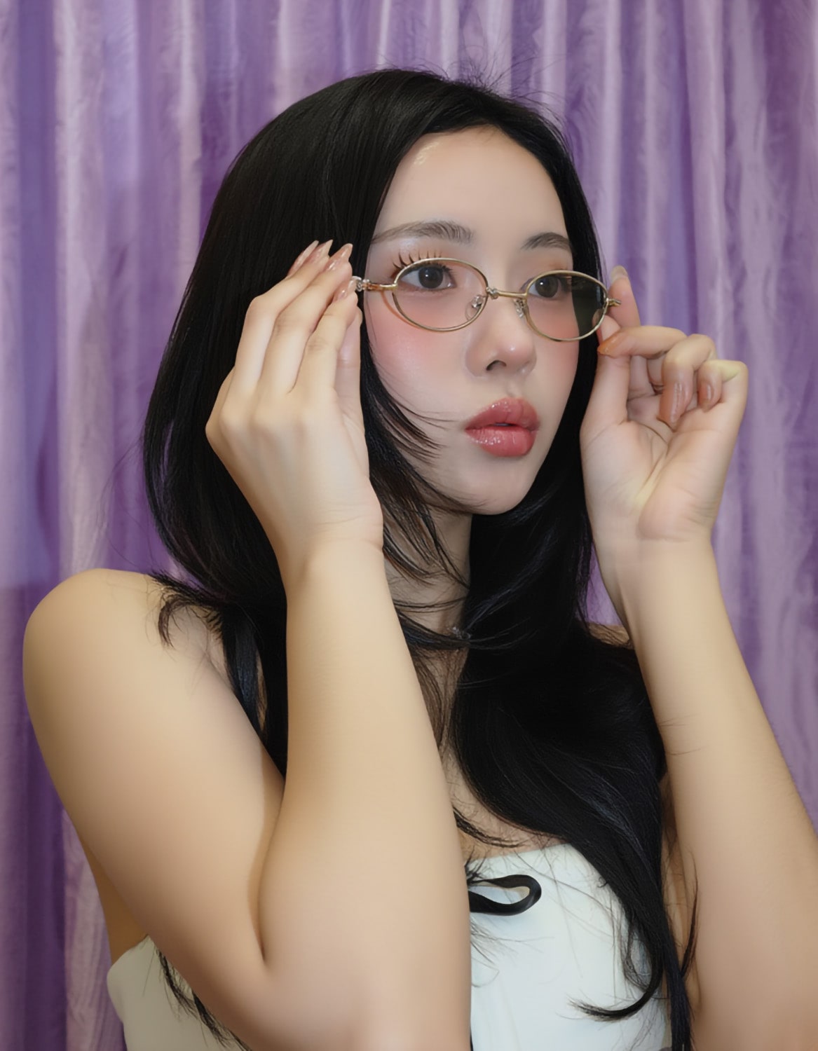 Woman adjusting Gentle Monster Pico 02 Oval Glasses against a purple curtain background