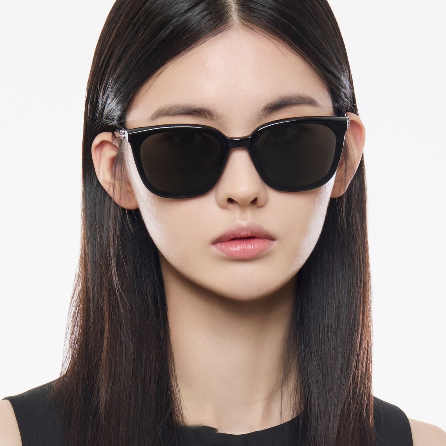 Woman wearing Gentle Monster Pino 01 Square Sunglasses with a plain background
