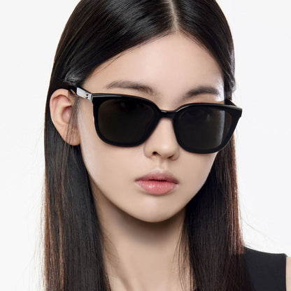 Person wearing Gentle Monster Pino 01 Square Sunglasses with a neutral background