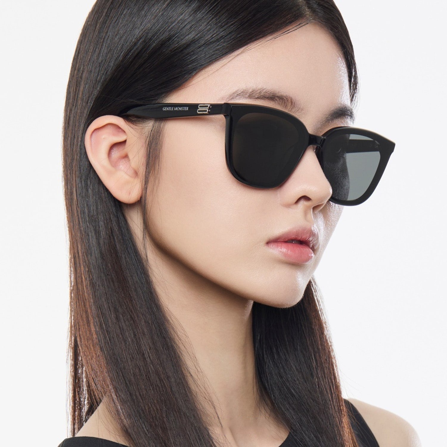 Woman wearing Gentle Monster Pino 01 Square Sunglasses with a neutral background