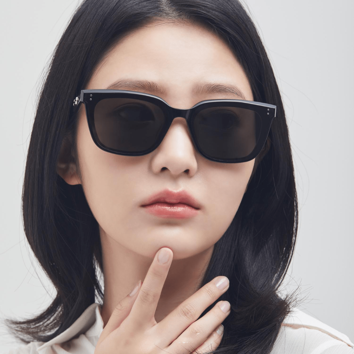Person wearing Gentle Monster (GM) Tote 01 with a neutral background