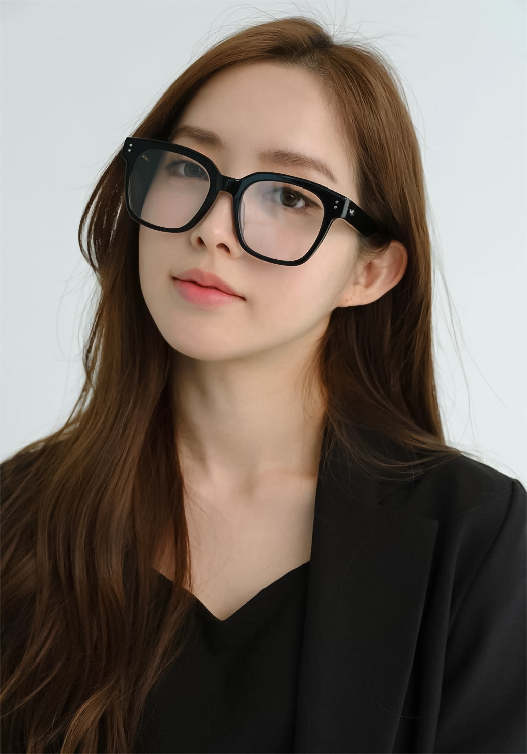 person wearing Gentle Monster Una.C N 01 Square Glasses with black suit on a white background