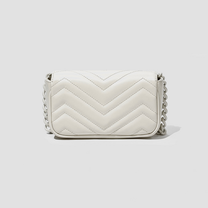 GUCCI MARMONT BELT BAG WHITE 699757 UM8KV 9022 with chain strap on a light gray background
