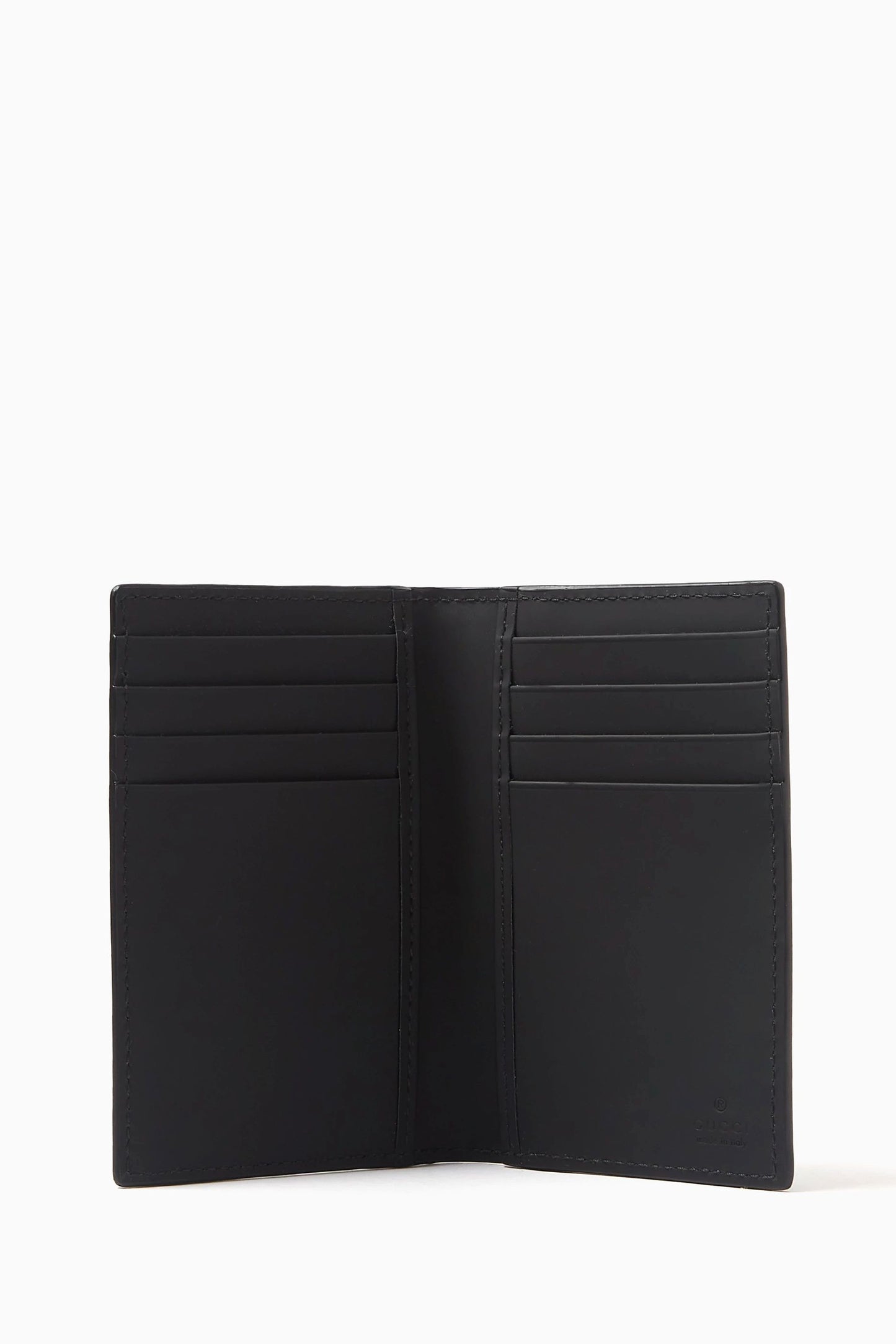 Gucci GG Black Rubber-Effect Long Card Case 771317 AAC0L 1000 - A black leather bi-fold wallet shown open, displaying multiple card slots on both sides, set against a plain white background. 