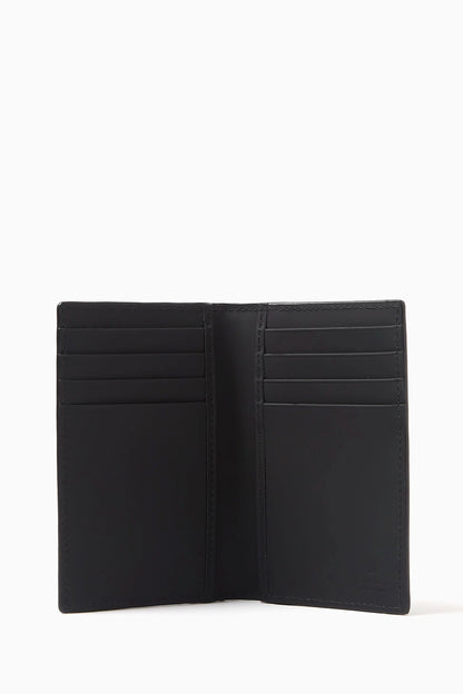 Gucci GG Black Rubber-Effect Long Card Case 771317 AAC0L 1000 - A black leather bi-fold wallet shown open, displaying multiple card slots on both sides, set against a plain white background. 