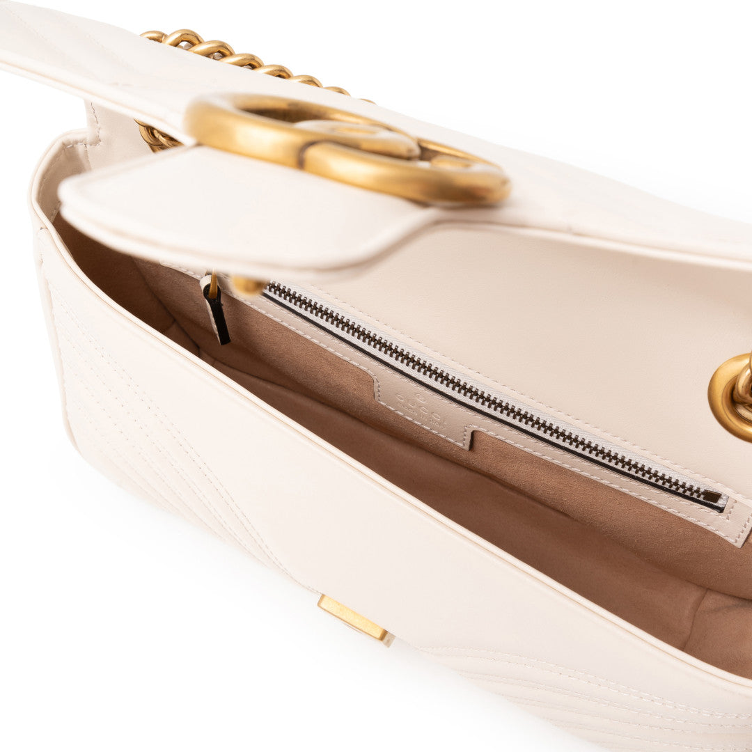 Close-up of a Gucci GG Marmont Medium Shoulder Bag White 443497 dtdit 9022 with gold accents on a white background