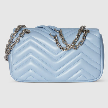 Gucci GG Marmont Small Shoulder Bag Light Blue Leather 837280 AAFA1 4928 with a chain detail on a light gray background