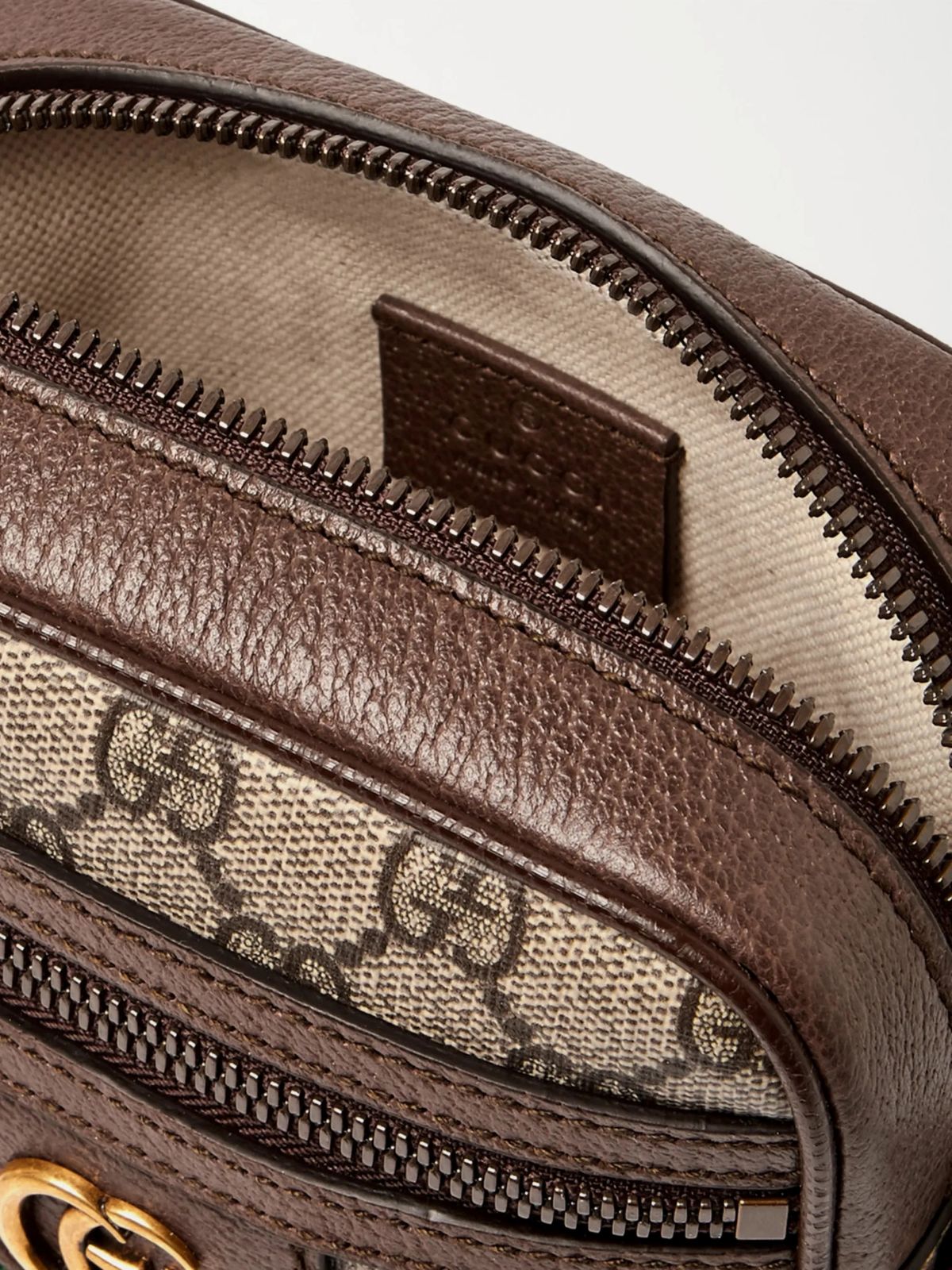 Close-up of a Gucci GG Supreme Ophidia Shoulder Bag 598127 96IWT 8745 with visible logo and zipper.