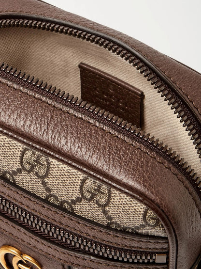 Close-up of a Gucci GG Supreme Ophidia Shoulder Bag 598127 96IWT 8745 with visible logo and zipper.