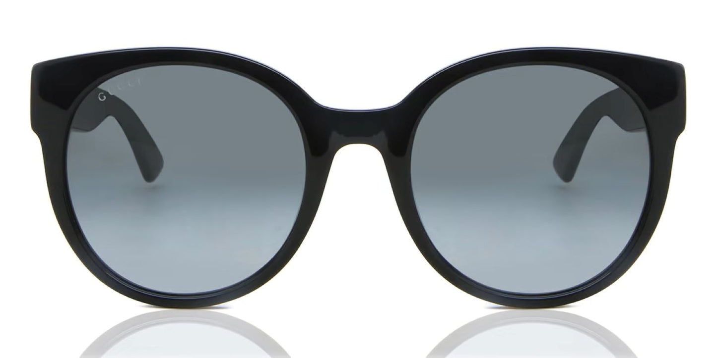 Portrait Gucci GG0035SN-001 Round Sunglasses with gray lenses on a white background