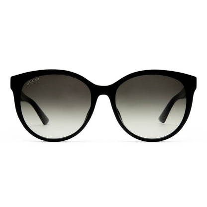 Gucci GG0636SK 001 Black Round Sunglasses with a glossy black frame and gradient gray lenses, shown against a plain white background.