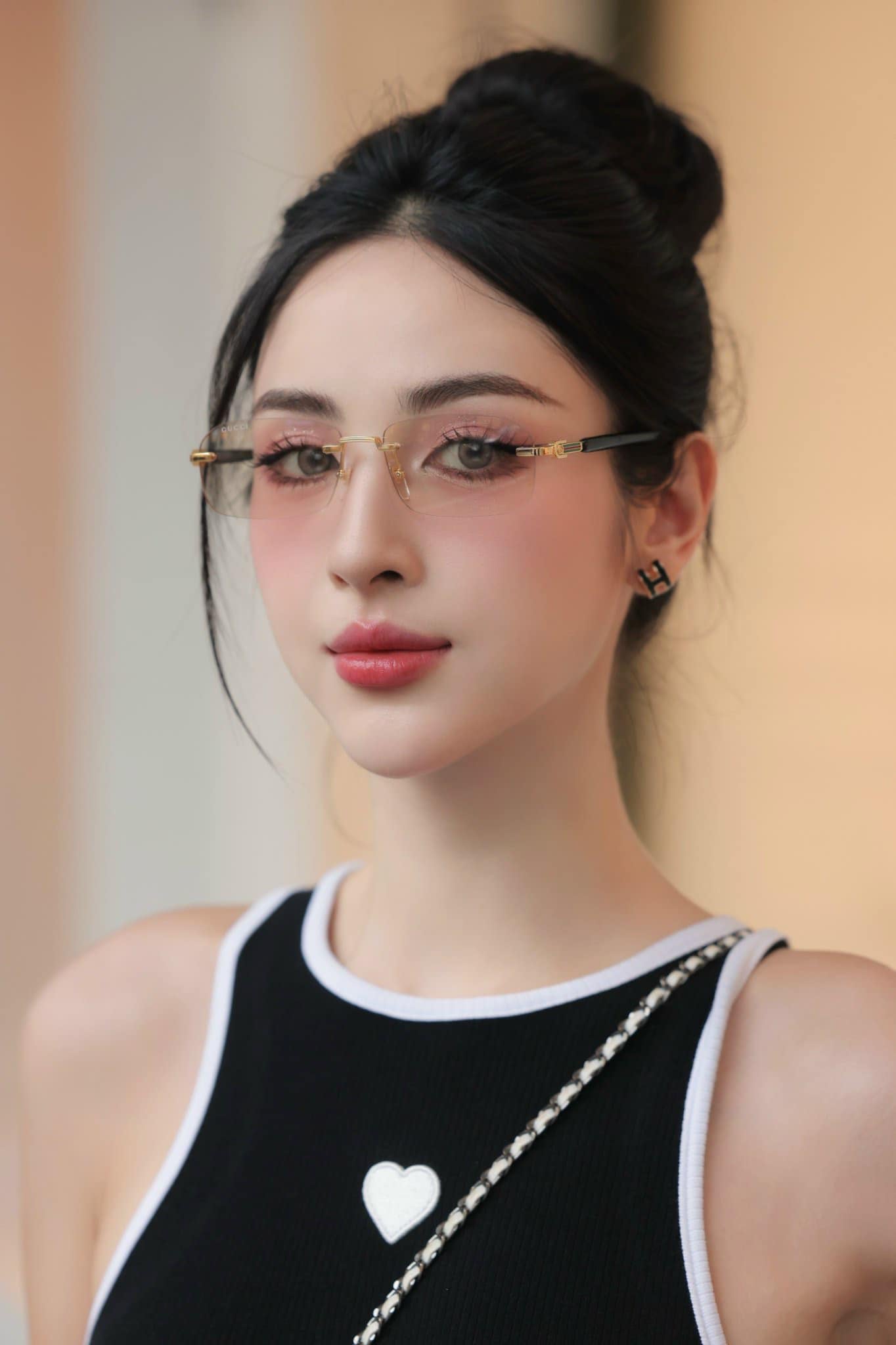 wearing GUCCI GG1221S 005 RIMLESS SUNGLASSES