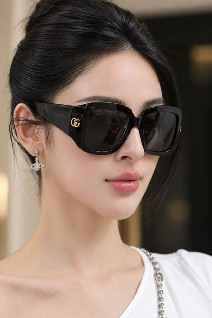 woman wearing Gucci GG1402S 001 Black Square Oversized Sunglasses with vivienne westwood earring