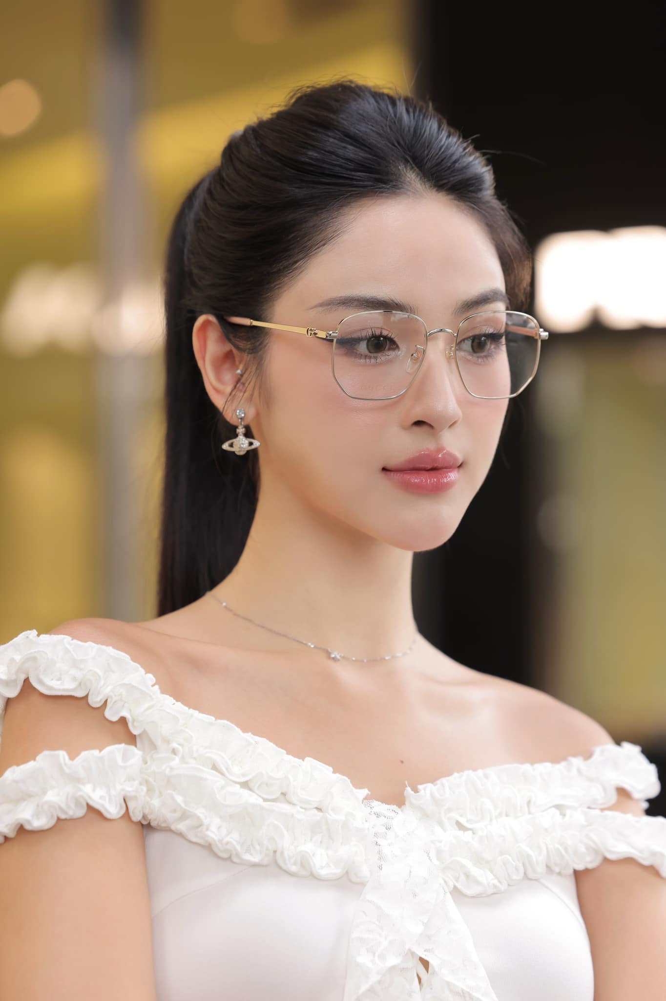 wearing GUCCI GG1420OK 003 GG GOLD METAL EYEGLASES