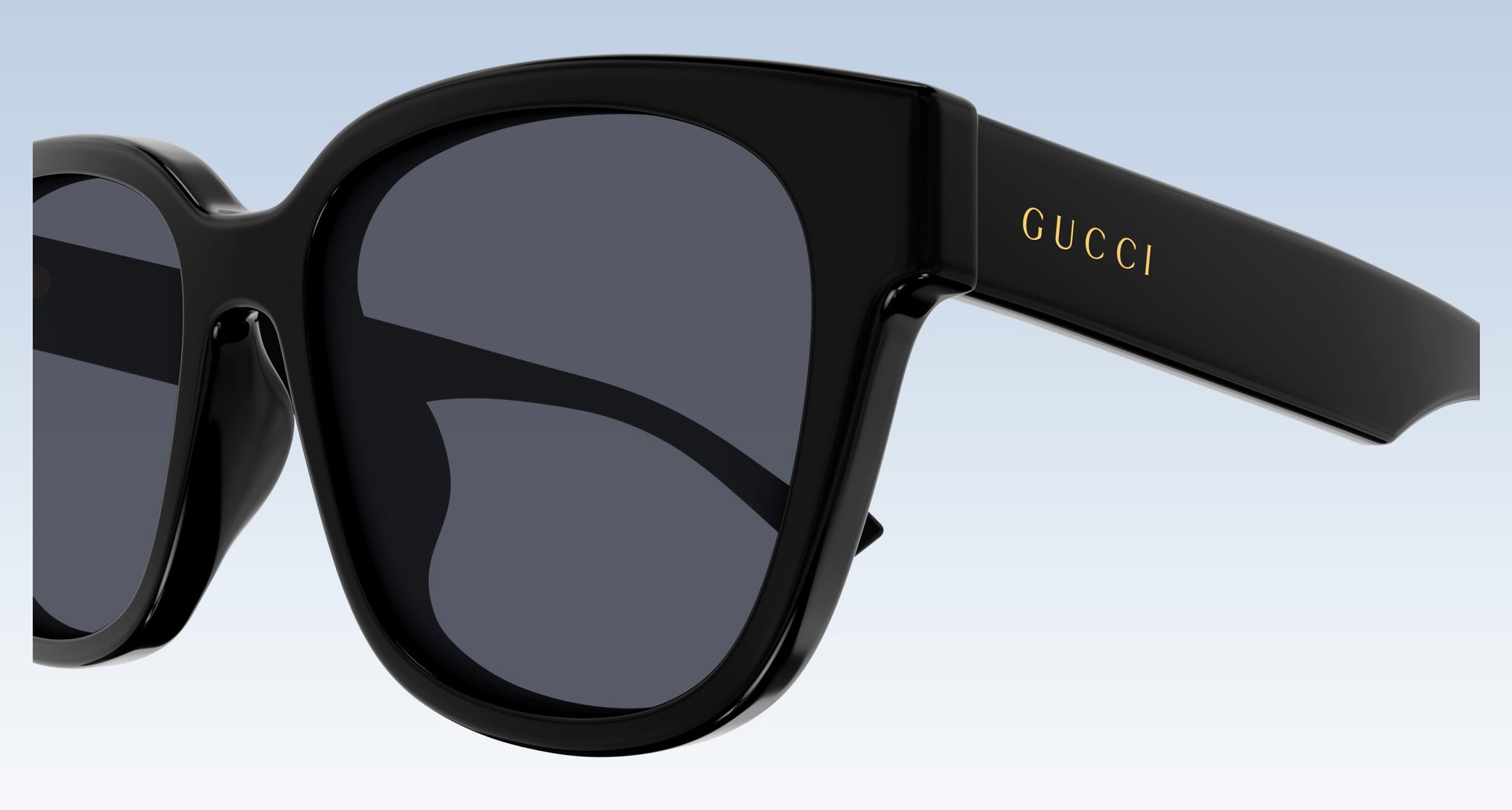 Gucci GG1430SK 001 Black Squared Sunglasses with a glossy black frame and dark gray lenses, featuring the gold 'GUCCI' logo on the temple arm.