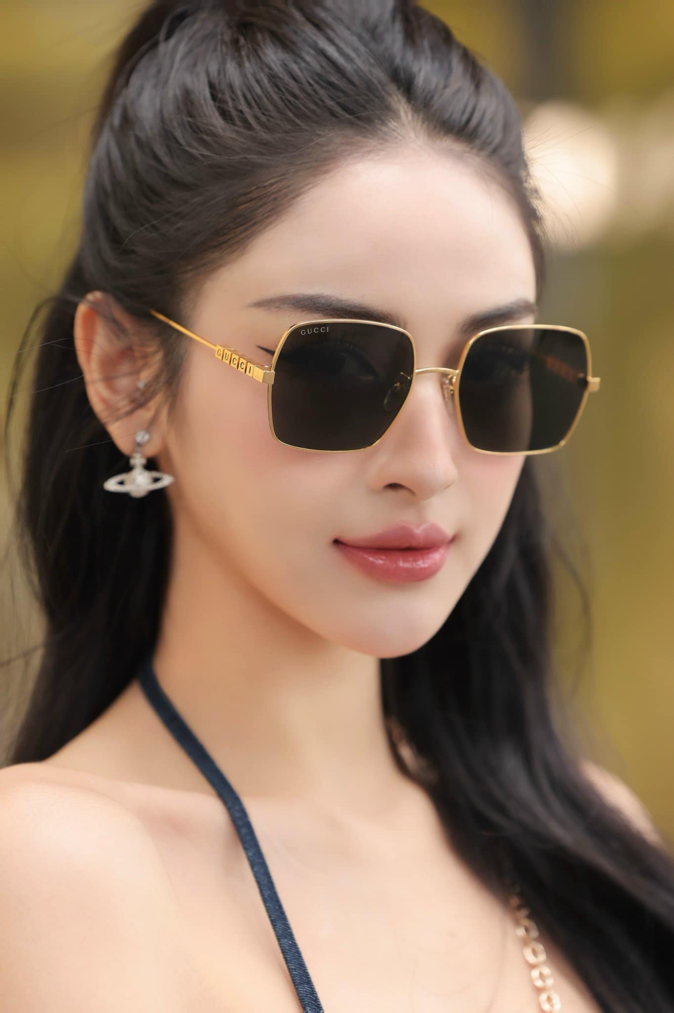 wearing GUCCI GG1434S 001 GOLD BLACK SUNGLASSES