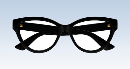Gucci GG1581O Black Cat-Eye Eyeglasses with gold metal rivets on the temples, shown against a light blue gradient background.