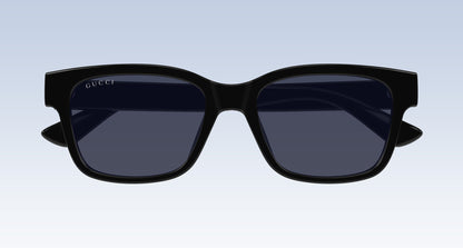 Gucci GG1716S Black Square Sunglasses with a thick black frame and dark tinted lenses, shown from the front on a light blue gradient background.