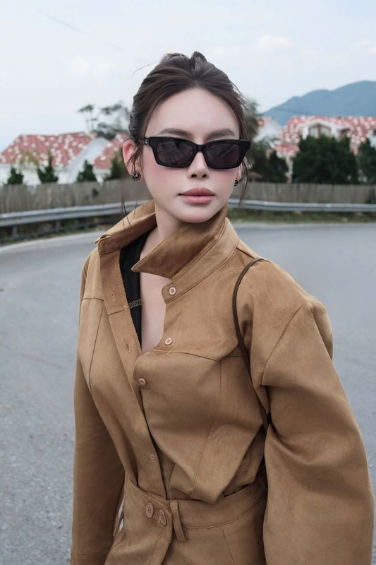 Model wearing Gucci GG1790S 001 Black Rectangular Sunglasses standing outside the road