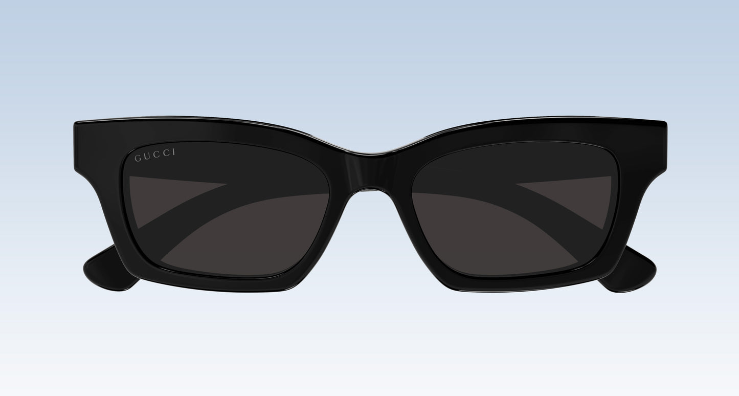 Gucci GG1790S 001 Black Rectangular Sunglasses with a glossy black frame and dark tinted lenses, shown from the front against a light blue gradient background.