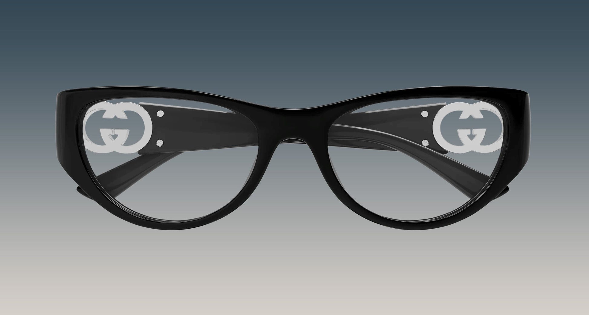 Gucci GG1825O 001 Black Rounded Rectangular Eyeglasses with a glossy finish and a prominent white interlocking GG logo printed on each lens, set against a dark-to-light gray gradient background.