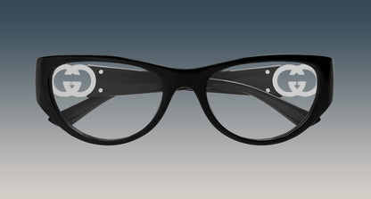Gucci GG1825O 001 Black Rounded Rectangular Eyeglasses with a glossy finish and a prominent white interlocking GG logo printed on each lens, set against a dark-to-light gray gradient background.