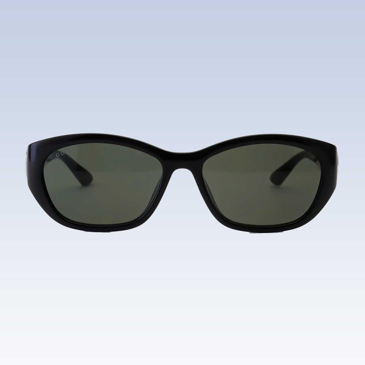 Gucci GG1826SK 001 Black Cat-Eye Sunglasses with dark green lenses, shown from the front against a light blue gradient background.
