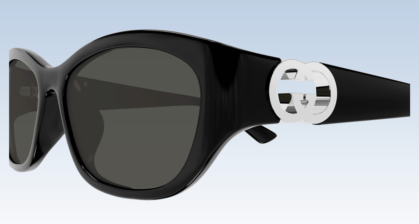 Gucci GG1826SK 001 Black Cat-Eye Sunglasses with a glossy black frame, dark gray lenses, and a signature silver interlocking GG logo on the temple arm.