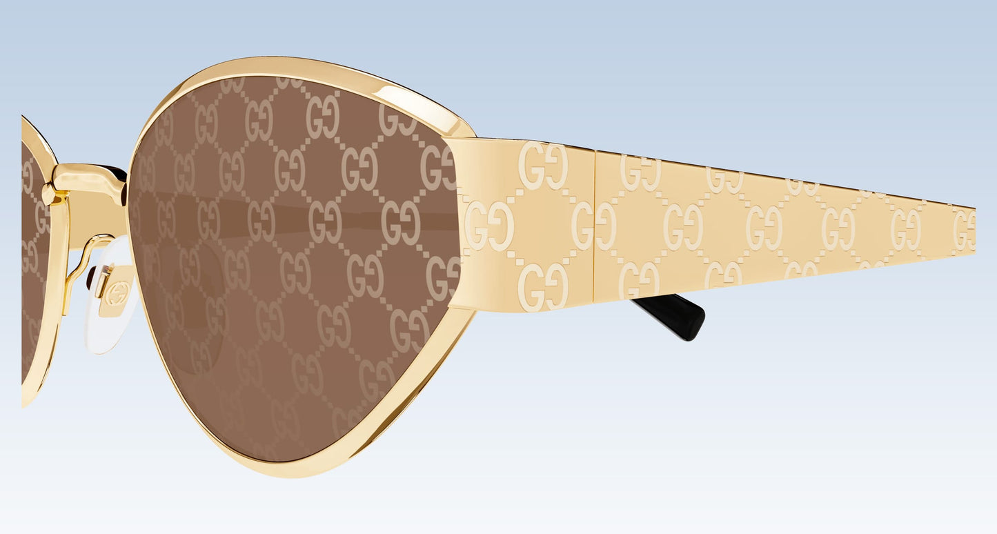 Gucci GG1853S 003 Gold Butterfly Sunglasses with a gold-tone metal frame, brown lenses featuring the signature GG monogram, and patterned temple arms.