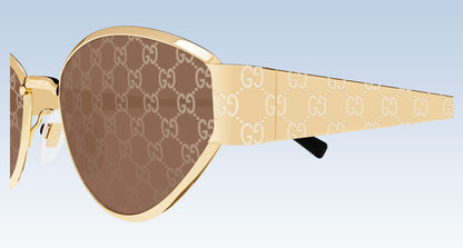 Gucci GG1853S 003 Gold Butterfly Sunglasses with a gold-tone metal frame, brown lenses featuring the signature GG monogram, and patterned temple arms.