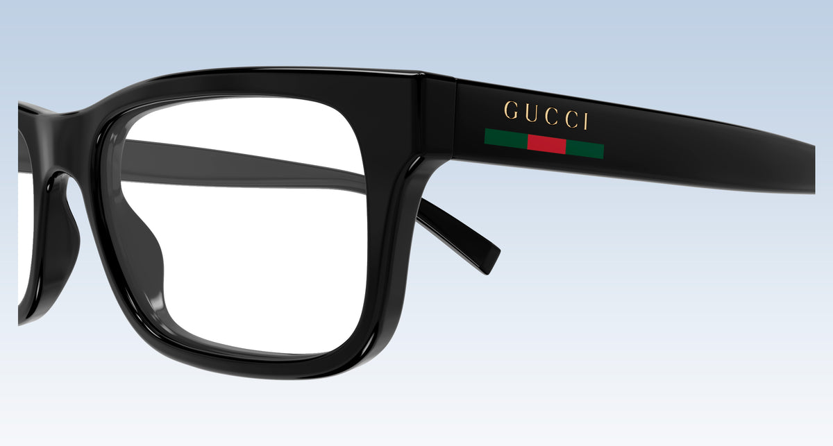 Gucci GG1858O Black Rectangular Eyeglasses with a signature green and red stripe on the temple arm and gold 'GUCCI' lettering, shown against a light blue gradient background.