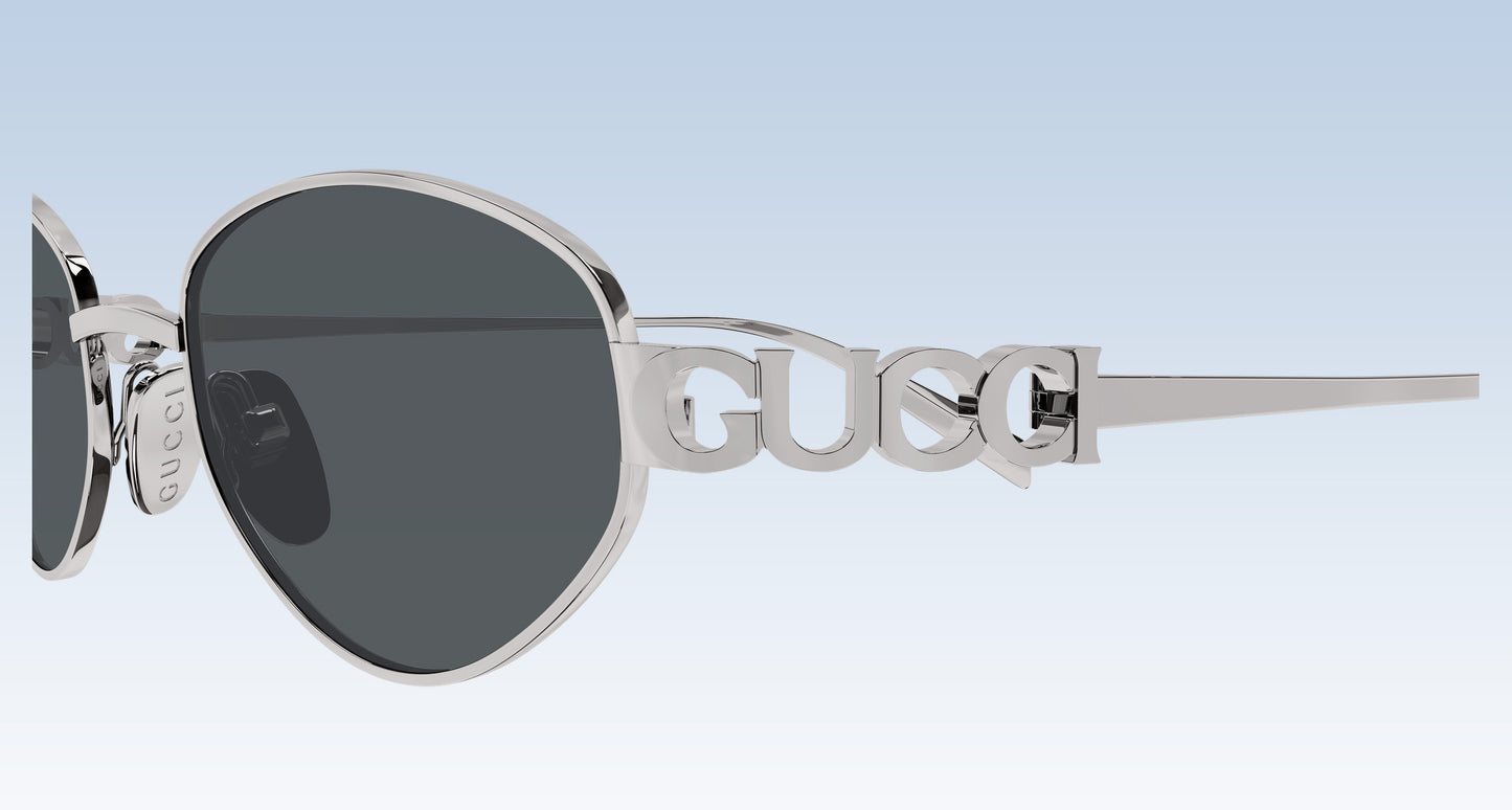 Close-up Gucci GG1935S 001 Silver Round Oval Sunglasses with lettering gucci temple