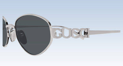 Close-up Gucci GG1935S 001 Silver Round Oval Sunglasses with lettering gucci temple